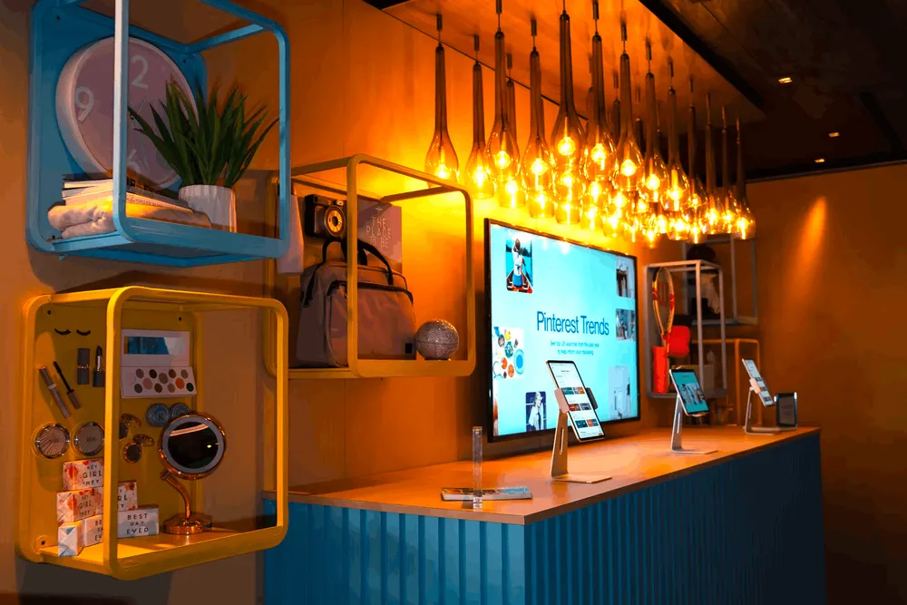 highly designed sponsor wall with a screen that displays pinterest trends